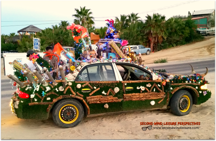 Highly decorated chaotic car drives through Baja streets